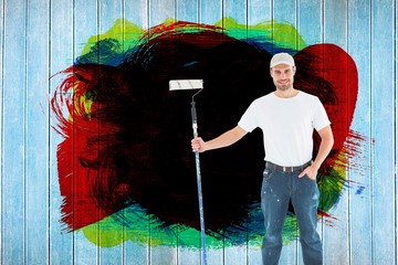 Man holding paint roller on white background