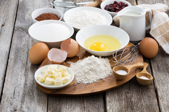 prepared baking ingredients on wooden table