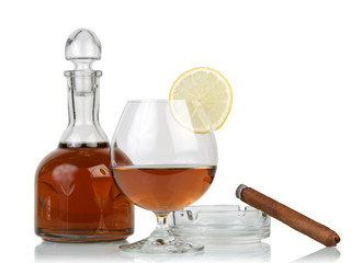 Glass of cognac with cigar