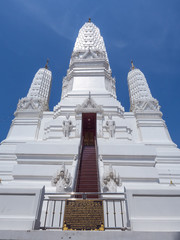 Large white pagoda under blue sky