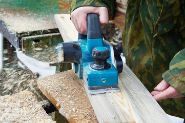 Carpenter with electric plane
