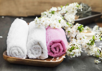 Obraz na płótnie Canvas Spa Setting with Cotton Towels and Flowers