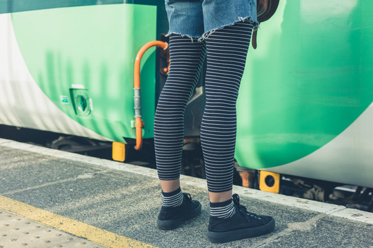 Woman standing on train platform