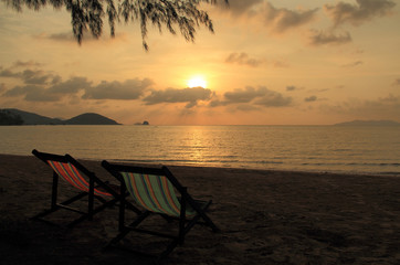 The Sunset view with couple beach chairs on the beach 