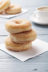 Fresh donut served with a cup of coffee