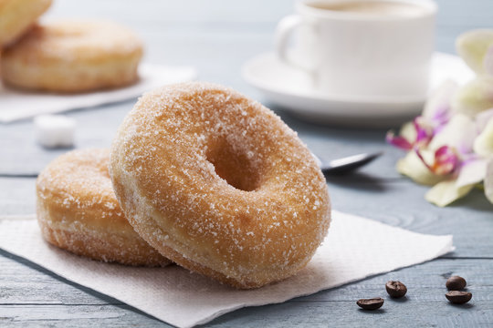 Fresh donut served with a cup of coffee
