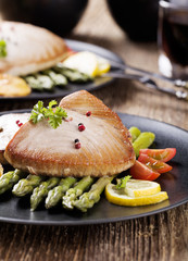 Grilled tuna steak served on asparagus with roasted zmieniakami