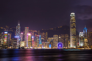 Fototapeta na wymiar illuminated skyscrapers in victoria harbor,hongkong.