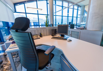 Modern office with confortable chair and desktop pc