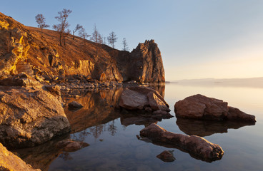 Lake Baikal. Bright colors of spring sunset on coastal cliffs