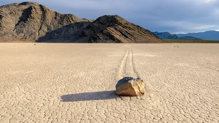  Moving stones in desert in the Racetrack playa, Death Valley National Park, California © lucky-photo