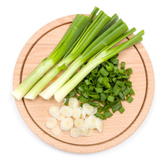 Freshly cut green onion on cutting board