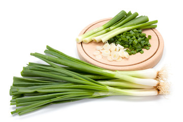 Freshly cut green onion on cutting board