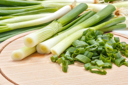 Freshly cut scallion on cutting board