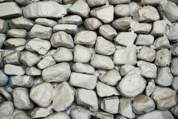 Seamless background texture of dark white old stone wall