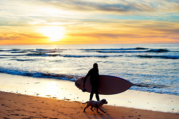 Surfer and dog