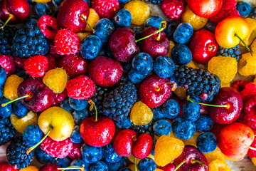 Fototapeta premium Mix of berries on wooden background
