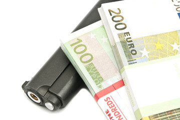 banknotes and gun