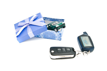car keys, green car and blue gift box
