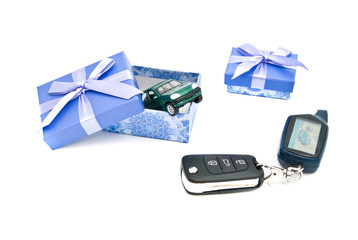 car keys, green car and blue gift boxes