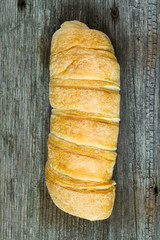 croissant on rustic wooden table