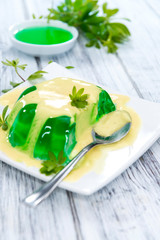 Portion of Woodruff Jelly with Vanilla Sauce