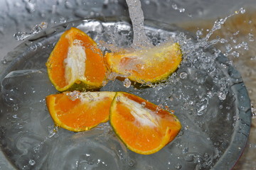 Fototapeta na wymiar water splash on orange