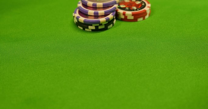 Close up of a poker table, people are betting in, a player shows full house