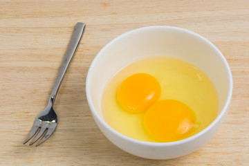 Raw eggs in a bowl, hammering