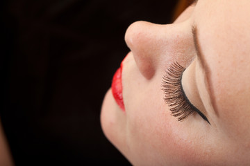 Red hair girl in pin-up style portrait shot in studio