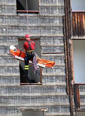 Fireman during an exercise carries the stretcher