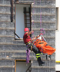 fireman during an exercise carries the stretcher