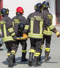 Firefighters carry a fellow firefighter with the medical stretch