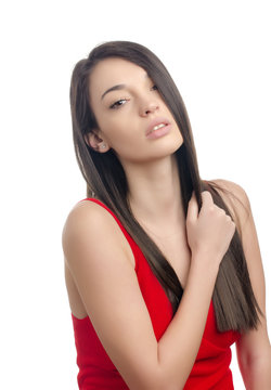 Gorgeous woman with long brunette hair wearing a sexy red dress.