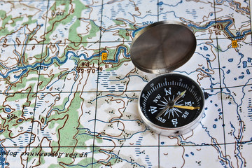 Fototapeta na wymiar Geographical map and a compass.