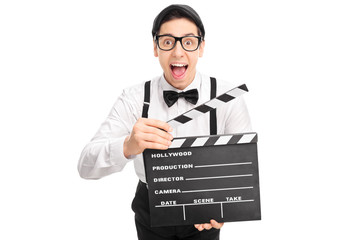 Excited movie director holding a clapperboard