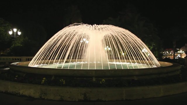 Fountain with lights at night in Monaco