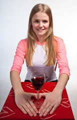 Scandinavian cute young girl hands shaping a heart and wine glas