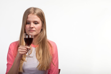 Scandinavian cute young girl drinking wine
