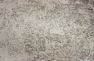 rough wall background with prominent porous patches