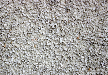 rough wall background with prominent porous patches