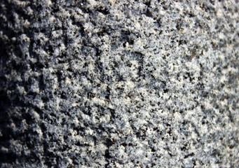 rough wall background with prominent porous patches