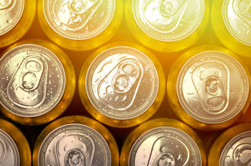Abstract vie of cold cans with refreshing drink background