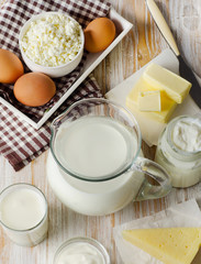Milk products on  wooden table.