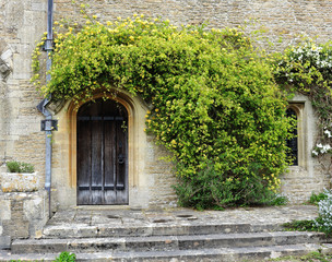 Fototapeta na wymiar Wooden door into a medieval building