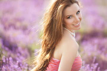 Happy woman lavender flowers, smiling beauty girl lavender field