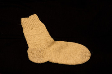 Knitted Sock on Dark Background