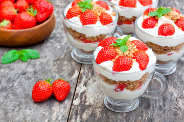 homemade desert with cream chopped cookies and fresh strawberry