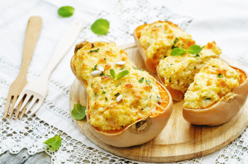 baked pumpkin with millet, vegetables and herbs