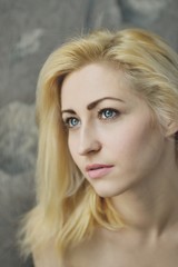 Naklejka premium Portrait close up of young beautiful blonde woman